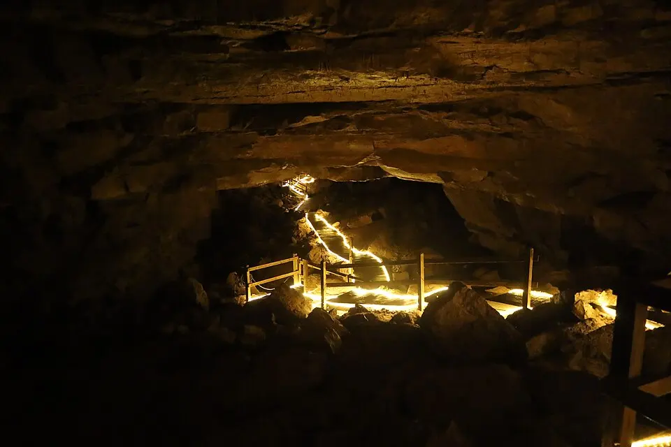 Lit cave passage and walkway beneath Horse Cave, Kentucky.