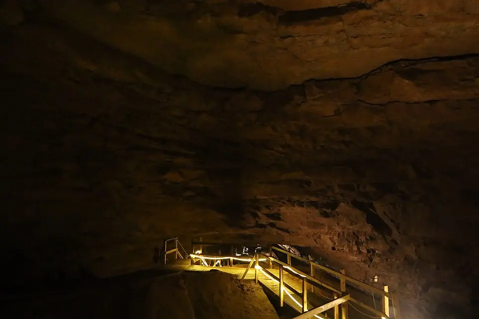 Illuminated stairway and railings inside Hidden River Cave in Horse Cave, Kentucky.