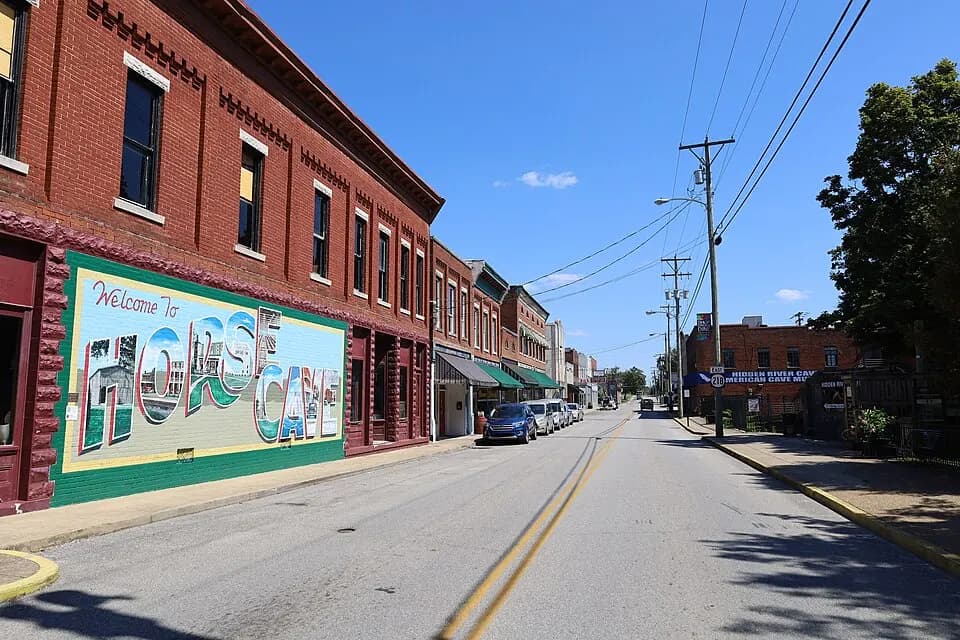 Colorful mural painted on brick storefronts along a Horse Cave, Kentucky street.
